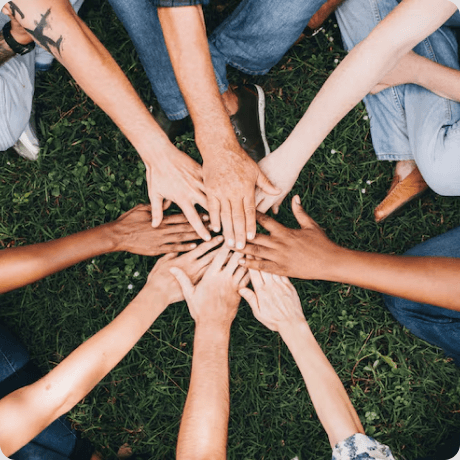 Community members joining hands